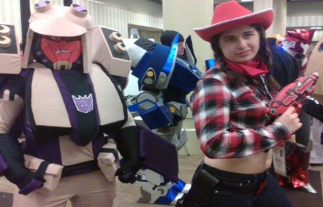 BotCon 2012 - Transformers in costume with a fan