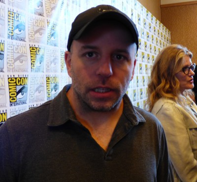 SDCC 2015 Travis Fickett in 12 Monkeys Syfy Press Room with Barbara Sukowa in the background