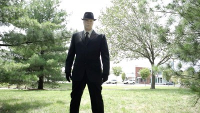 Milgram and the Fast Walkers - Josh Davidson as the  man in in the brimmed hat